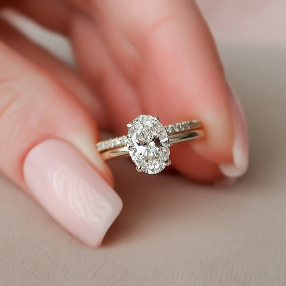 14K rose gold bridal set featuring an oval engagement ring and simple micro pave wedding band. Oval Engagement Ring With Wedding Band