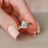 14K white gold bridal set with pear-shaped moissanite engagement ring and wedding band for a timeless style