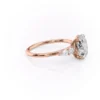 2 carat oval moissanite engagement ring in rose gold with pear and round cluster side stones (4)