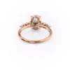2 carat oval moissanite engagement ring in rose gold with pear and round cluster side stones (6)