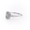 2 carat oval moissanite engagement ring in white gold angled side view showing slim band and pear accent cluster (1)