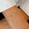 2.5 Ct Diamond Tennis Bracelet in 14K Gold Studded With Moissanite this Exclusive 14k Gold bracelet have Heart center diamond wearing in hand