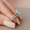 Oval Engagement Ring with Wedding Band Set 2.5-carat oval cut moissanite engagement ring and a matching wedding band. The engagement ring features a braided diamond band and the wedding band has ma