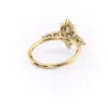 3 carat marquise moissanite ring in yellow gold rear view showing open basket V-tip claw setting