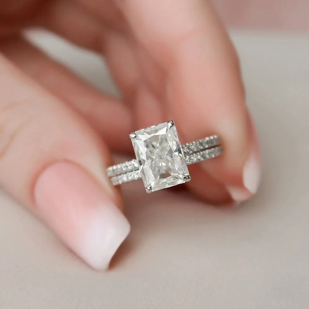 3.0 Ct Elongated Radiant Cut Engagement Rings. Paired with a stunning 14K gold pave band, it’s the perfect combination of sparkle and style.