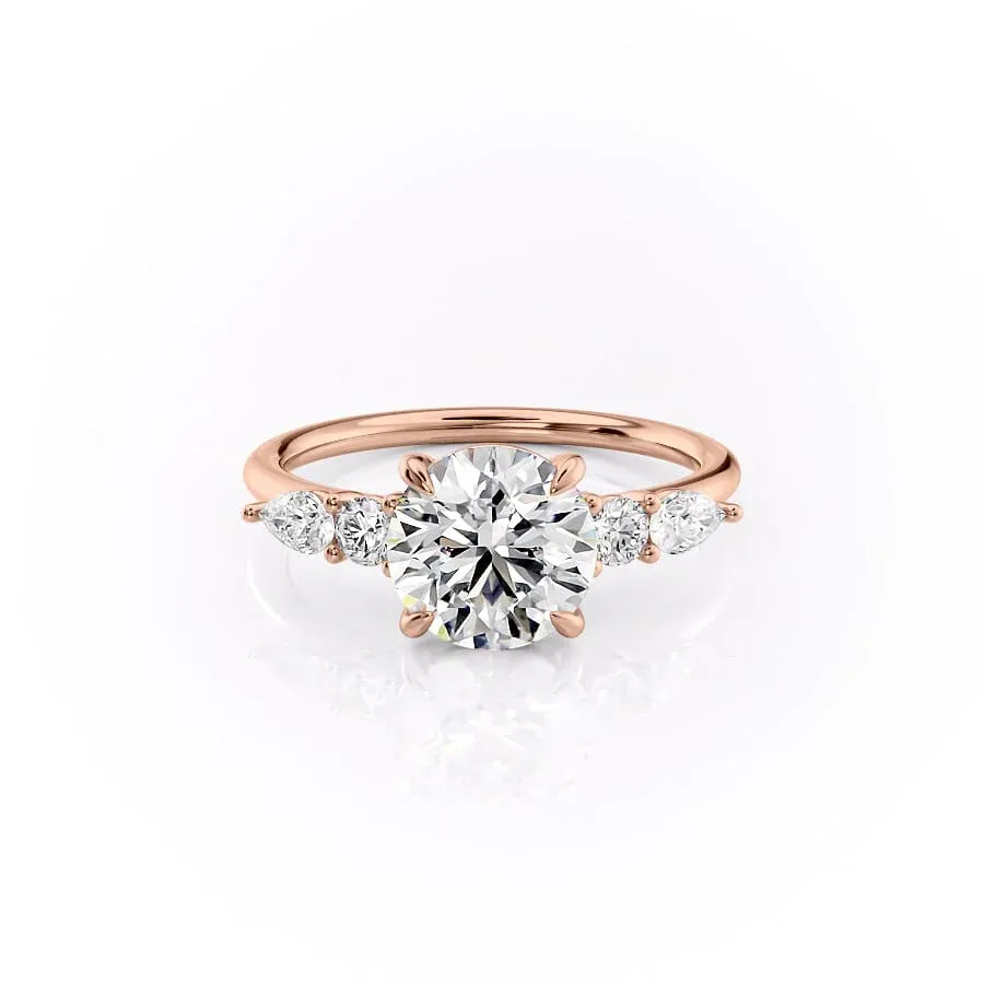 4 ct round diamond engagement ring in Rose gold angled side view showing slim band and staggered pear and round cluster shoulders