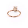 The Seraphina | Hidden Halo Oval Moissanite Engagement Ring A romantic 18K rose gold hidden halo oval moissanite engagement ring