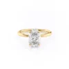 A sparkling 14K yellow gold hidden halo oval engagement ring