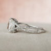 A stunning white gold engagement ring featuring a brilliant diamond center and elegant pear split shank design.