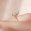 Classic 14K white gold pear-shaped moissanite engagement ring and matching wedding band for her special day.