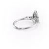 Delicate white gold band of a pear shaped diamond wedding ring showing slim shank and cluster setting (2)