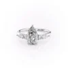 Delicate white gold band of a pear shaped diamond wedding ring showing slim shank and cluster setting (3)