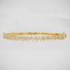Discover refined elegance with this 14K Gold Bangle Bracelet, featuring tapered baguette moissanite stones for a stunning, classic look that never goes out of style