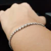Stylish 2.5 Ct Graduated Moissanite tennis bracelet in 18K gold