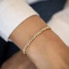 This Tapered Baguette Moissanite Bangle Bracelet in 14K gold offers a perfect balance of classic design and modern sparkle. Ideal for timeless style and sophisticat