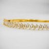 This luxurious Tapered Baguette Moissanite Bangle Bracelet, crafted in 14K gold, exudes classic elegance and refined style. Perfect for special occasions and daily