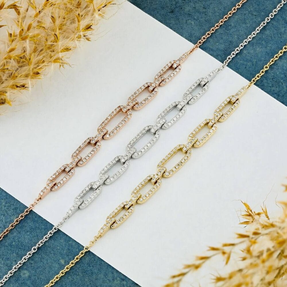 Timeless elegance meets modern design in this 14K Gold Graduated Pavé Paper Clip Bracelet with an adjustable cable chain, ideal for both casual and formal