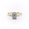 Yellow gold classic emerald cut rings back profile showing four claw setting slim band