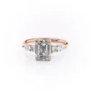moissanite Classic emerald cut engagement rings in rose gold with pear and round cluster side stones front face-up view
