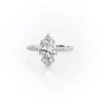 Sparkling marquise cut moissanite engagement ring with hidden halo.