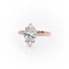 Sparkling marquise cut moissanite engagement ring with hidden halo.