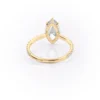 Sparkling marquise cut moissanite engagement ring with hidden halo.