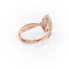 Sparkling yellow gold marquise diamond engagement ring with twisted band.
