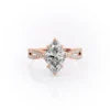 Sparkling yellow gold marquise diamond engagement ring with twisted band.
