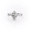 Sparkling yellow gold marquise diamond engagement ring with twisted band.
