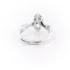 Sparkling yellow gold marquise diamond engagement ring with twisted band.
